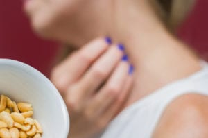 young woman scratching herself.