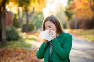 young woman suffering from allergies