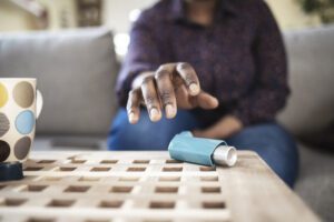 man approaching his asthma inhalers